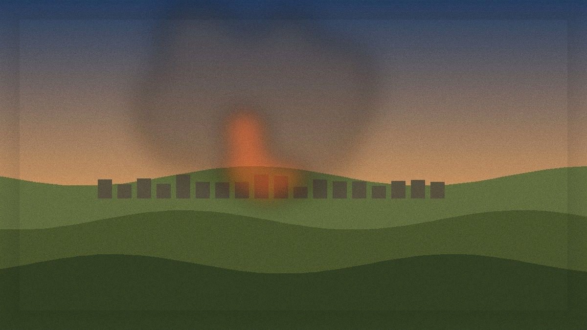 Smoke rising over south Lebanon hills at dusk near scattered village buildings